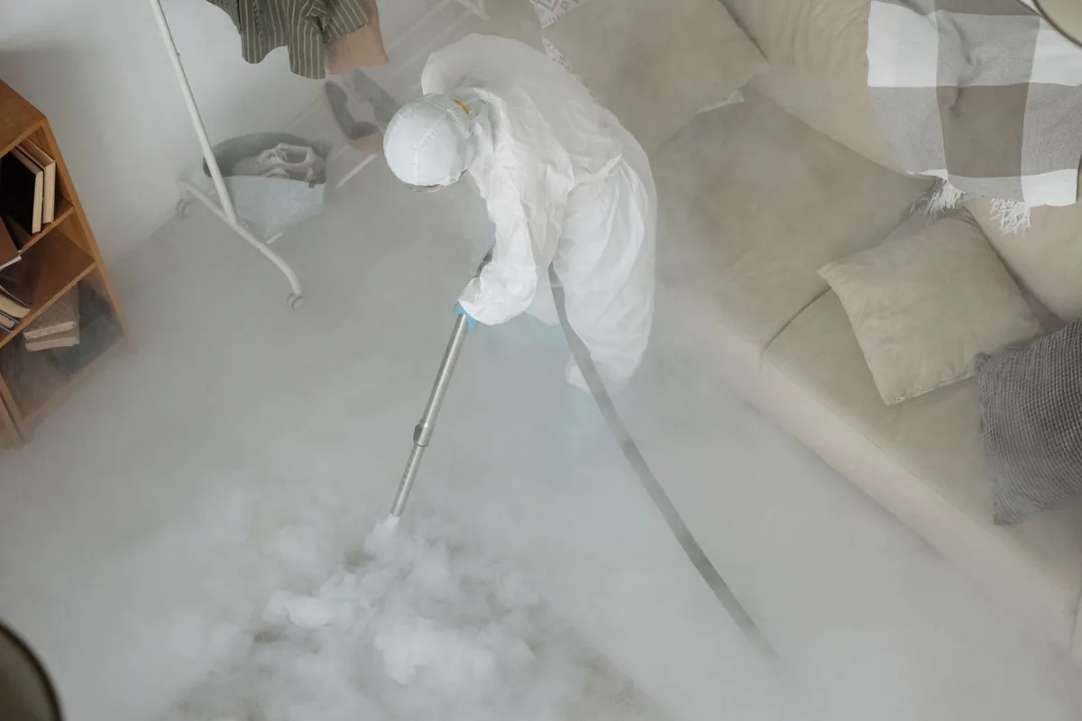 Biohazard cleanup technician in protective equipment, Eastside, Riverside, CA